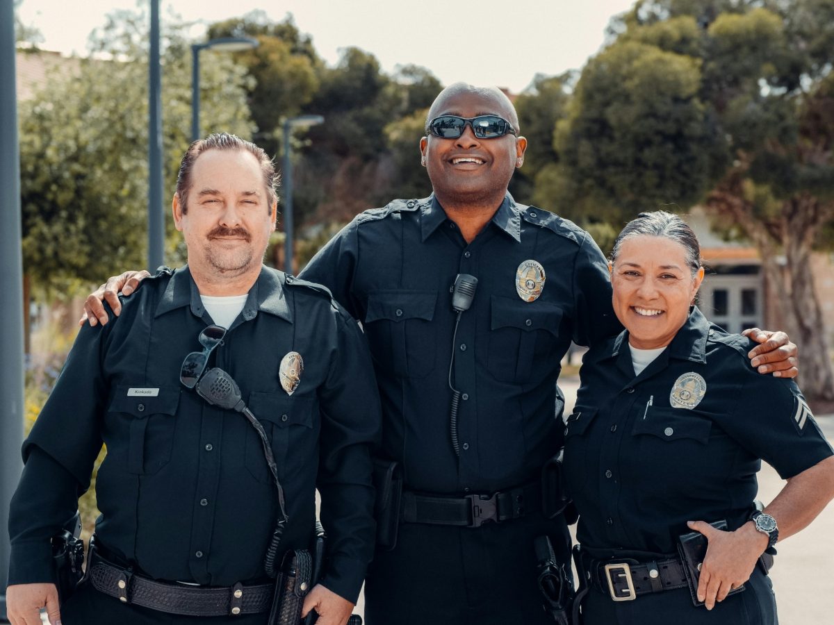 3 first responders or police officers in uniform or gear